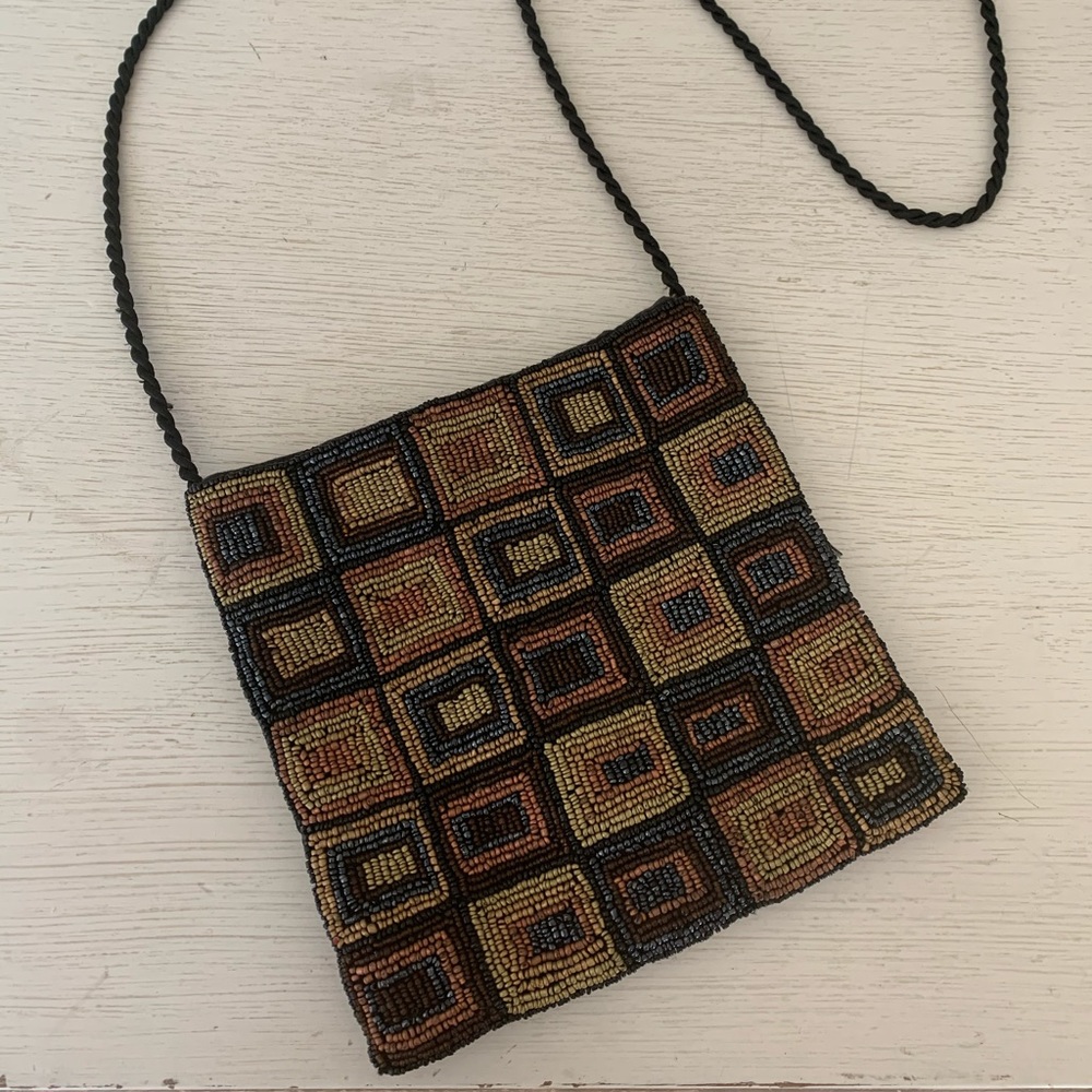 Hand beaded geometric shoulder bag.
